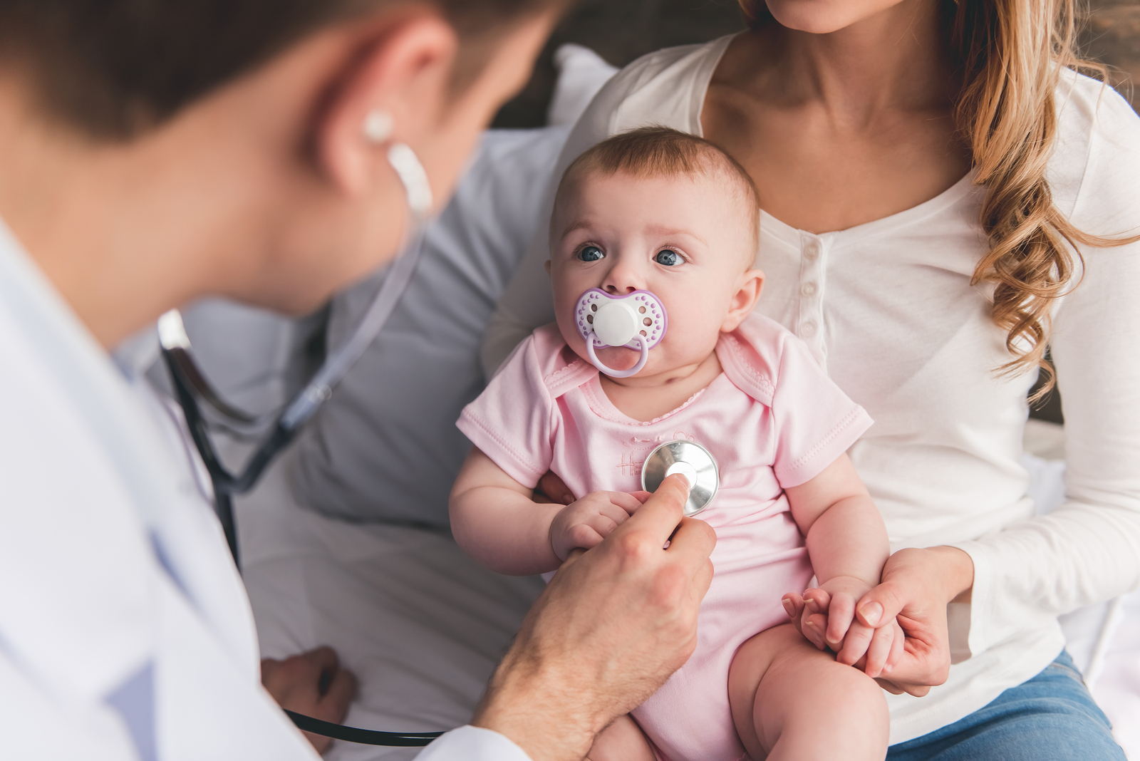 pediatrician checking baby